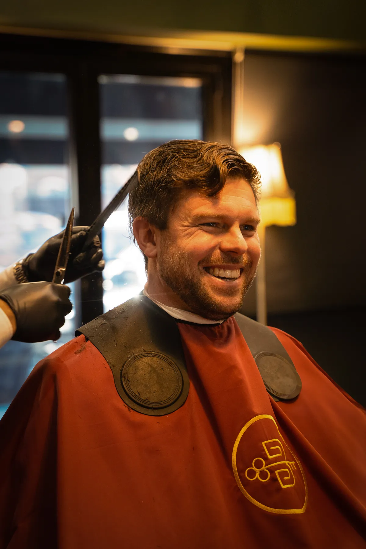 A client at ease, mid-cut in the chair
